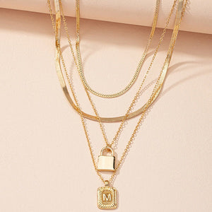 Gold Initial Letter and Lock Multi Layer Necklace in Gold Setting