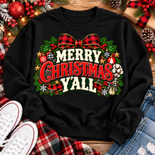 Load image into Gallery viewer, Merry Christmas Y'all graphic apparel featuring vintage red, green, and cream lettering with a festive buffalo plaid bow, Christmas ornaments, pine greenery, and rustic holiday decorations. Southern Christmas graphic available in two colors and four styles, including short sleeve crewneck, V-neck, long sleeve, and hoodie.
