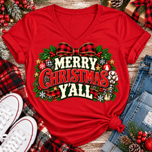 Load image into Gallery viewer, Merry Christmas Y'all graphic apparel featuring vintage red, green, and cream lettering with a festive buffalo plaid bow, Christmas ornaments, pine greenery, and rustic holiday decorations. Southern Christmas graphic available in two colors and four styles, including short sleeve crewneck, V-neck, long sleeve, and hoodie.
