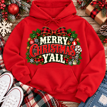 Load image into Gallery viewer, Merry Christmas Y'all graphic apparel featuring vintage red, green, and cream lettering with a festive buffalo plaid bow, Christmas ornaments, pine greenery, and rustic holiday decorations. Southern Christmas graphic available in two colors and four styles, including short sleeve crewneck, V-neck, long sleeve, and hoodie.
