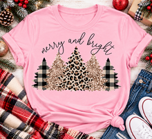 Load image into Gallery viewer, Merry and Bright Christmas graphic apparel featuring leopard print, buffalo plaid and glitter-inspired gold Christmas trees, available in three colors and four styles including crewneck tee, V-neck tee, sweatshirt and hoodie.
