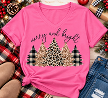 Load image into Gallery viewer, Merry and Bright Christmas graphic apparel featuring leopard print, buffalo plaid and glitter-inspired gold Christmas trees, available in three colors and four styles including crewneck tee, V-neck tee, sweatshirt and hoodie.
