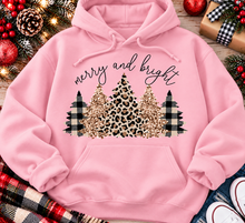 Load image into Gallery viewer, Merry and Bright Christmas graphic apparel featuring leopard print, buffalo plaid and glitter-inspired gold Christmas trees, available in three colors and four styles including crewneck tee, V-neck tee, sweatshirt and hoodie.
