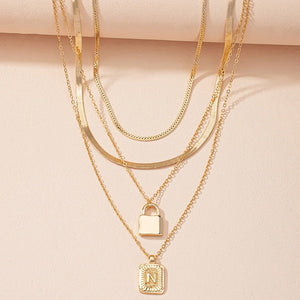 Gold Initial Letter and Lock Multi Layer Necklace in Gold Setting