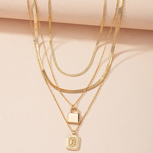 Gold Initial Letter and Lock Multi Layer Necklace in Gold Setting