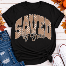 Load image into Gallery viewer, Saved by Grace faith graphic apparel with polka dot lettering, available in brown, navy and black V-neck, long sleeve, crewneck and hoodie styles.
