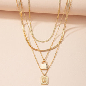 Gold Initial Letter and Lock Multi Layer Necklace in Gold Setting