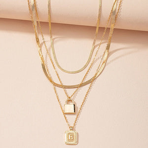 Gold Initial Letter and Lock Multi Layer Necklace in Gold Setting