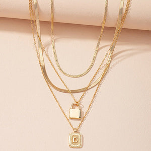 Gold Initial Letter and Lock Multi Layer Necklace in Gold Setting