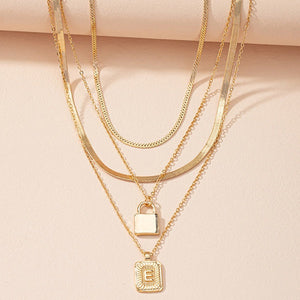 Gold Initial Letter and Lock Multi Layer Necklace in Gold Setting