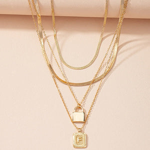 Gold Initial Letter and Lock Multi Layer Necklace in Gold Setting