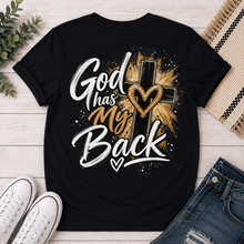 Load image into Gallery viewer, Back: Black God Has My Back Christian graphic tee featuring a bold black cross with white and brown lettering, heart details and distressed accents.
