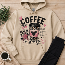 Load image into Gallery viewer, Cream Coffee My Love Language hoodie featuring a pink and leopard print coffee cup, black checkerboard design, hearts, stars and Strong Coffee Positive Mind Good Vibes text.
