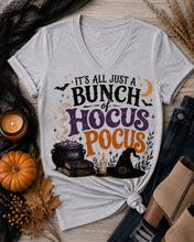 Load image into Gallery viewer, Hocus Pocus Halloween graphic V-neck tee with witch hat, cauldron and spell books
