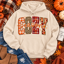 Load image into Gallery viewer, Cream Cozy Season fall hoodie featuring plaid, leopard and autumn print graphic
