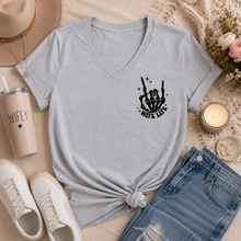 Load image into Gallery viewer, Gray v-neck graphic tee featuring a small black skeleton hand and “Wife Life” design on the front chest.
